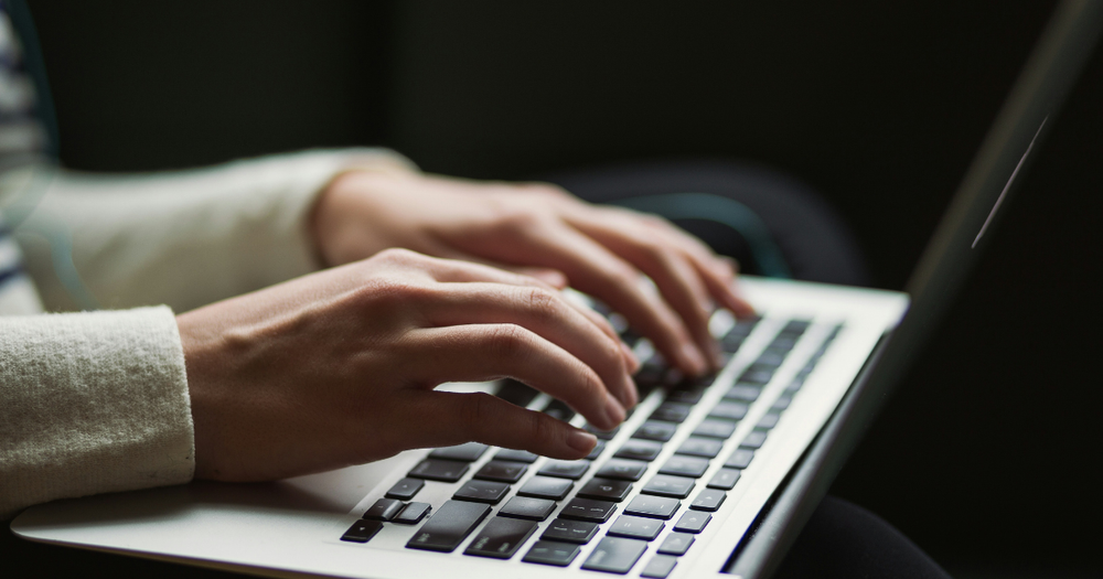 Professional reviewing an ecommerce website on a laptop